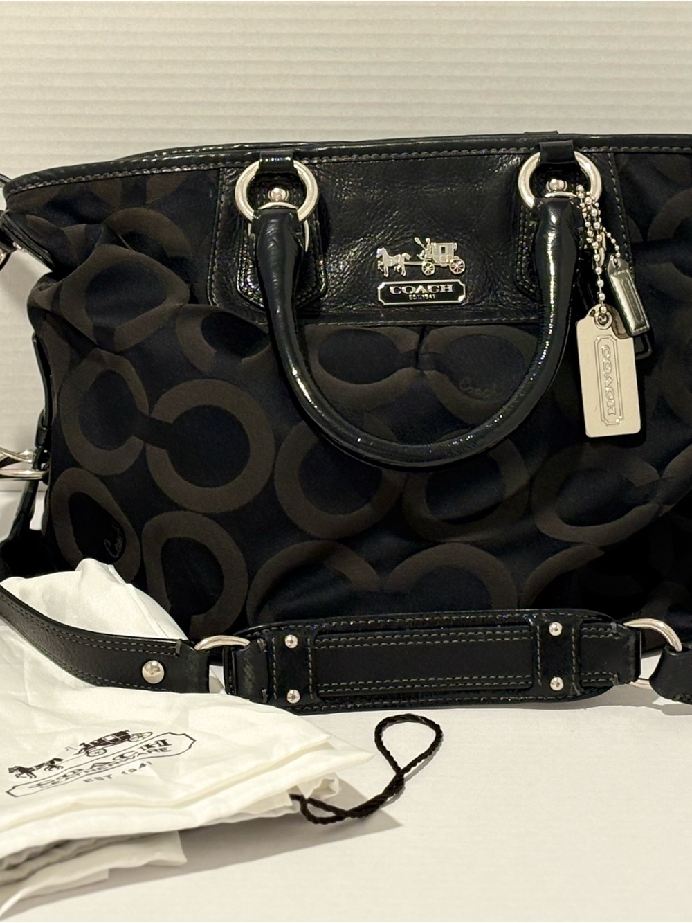 Coach Madison Op Art Signature satchel bag with dual strap and silver accent